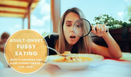 Person holding a plate of varied foods, representing overcoming adult-onset fussy eating.