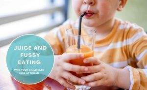 Child drinking fruit juice at the table instead of eating a meal