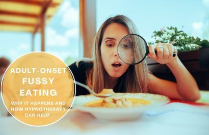 Person holding a plate of varied foods, representing overcoming adult-onset fussy eating.