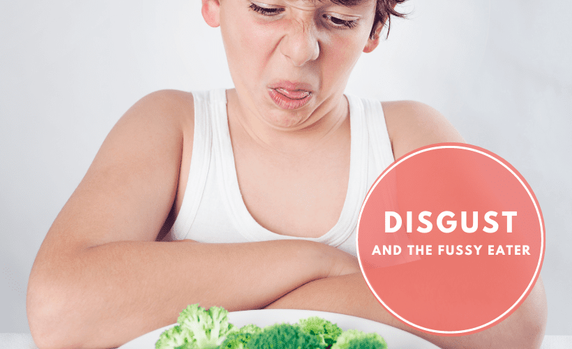 Child pulling face at plate of yukky food