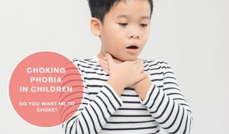 Child holding throat to illustrate choking phobia and difficulty swallowing, a symptom linked with ARFID.